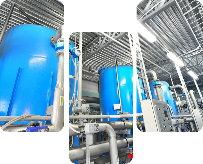 Large blue tanks in a industrial city water treatment boiler room.